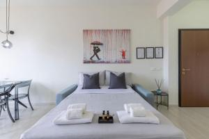 a bedroom with a large bed with two pillows at Castle Free Private Parking 18 min di treno Firenze in Prato