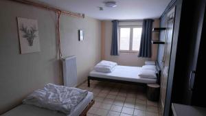 Ένα ή περισσότερα κρεβάτια σε δωμάτιο στο Chalet Les Deux Ourthes