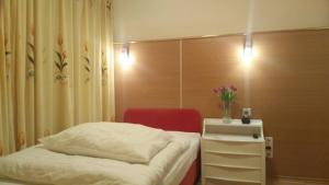 Postel nebo postele na pokoji v ubytování Hotel Adler