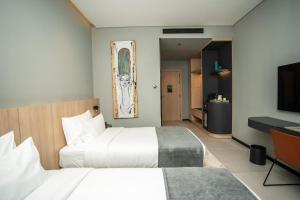Sama Hotels客房内的一张或多张床位
