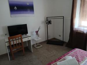 Телевизор и/или развлекательный центр в San Giacomo Rooms