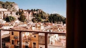 a view of a city from a building at Taormina Palazzo di Ferro in Taormina