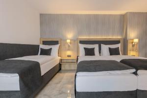 Ένα ή περισσότερα κρεβάτια σε δωμάτιο στο Hotel Tříška