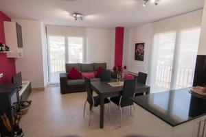 a living room with a table and a couch at Apartament Bagà in Bagá