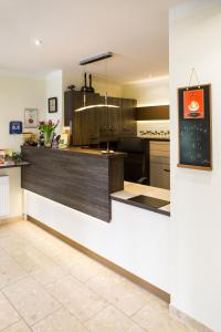 a kitchen with a counter and a counter top at Hotel Weisse Elster in Zeitz