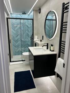 a bathroom with a sink and a mirror at Apartment Ivan in Pomorie