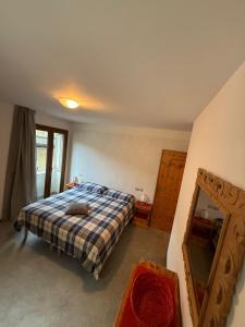 A bed or beds in a room at Appartamento Marco