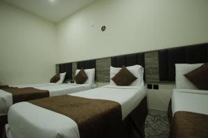 Voodi või voodid majutusasutuse Mila HOTEL MAKKAH toas