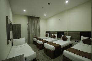 Voodi või voodid majutusasutuse Mila HOTEL MAKKAH toas