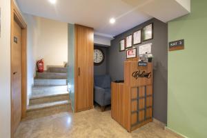 a hallway with a waiting room with a clock on the wall at İstanbulites Hotel in Istanbul