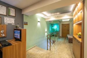 an office with a hallway with a desk and a staircase at İstanbulites Hotel in Istanbul