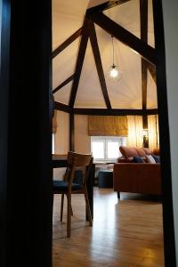 a living room with a couch and a chair at Astronomica na Kopernika in Toruń