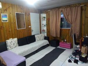 a living room with a couch and a table at Inature in Florianópolis