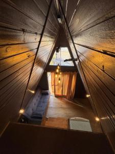 an overhead view of a room in a wooden house at Cabana Aroma do Mar in Jaguaruna
