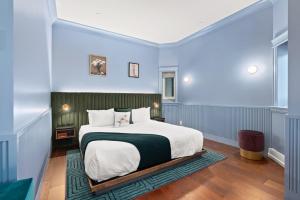 Postel nebo postele na pokoji v ubytování Hôtel Maurice