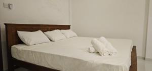 Letto o letti in una camera di VThree Family House