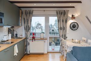 Kuchyň nebo kuchyňský kout v ubytování Apartament Chateau Karpielówka Kościelisko