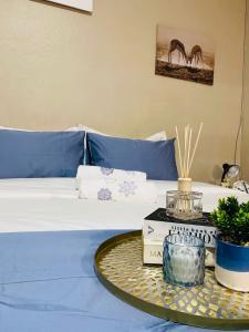 Postel nebo postele na pokoji v ubytování Imizamo Accommodation