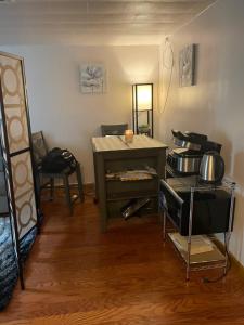 a room with a table and some pots and pans at Your Home away from Home ! in Baychester
