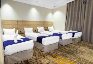 Postel nebo postele na pokoji v ubytování hotel el amri akchour
