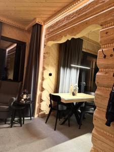 a dining room with a table and chairs in a building at Domek & Apartament Góralski z Jacuzzi Kościelisko in Kościelisko +183 photos