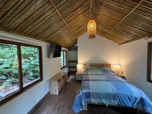 Postel nebo postele na pokoji v ubytování Cabaña Coffee Suite