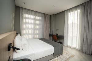 Sama Hotels客房内的一张或多张床位