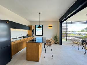 Köök või kööginurk majutusasutuses Appart hôtel PALM Suites CAYENNE