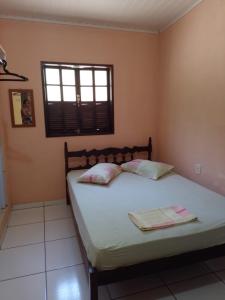 En eller flere senge i et værelse på Apartamento em Chácara Aconchegante - Kitnet