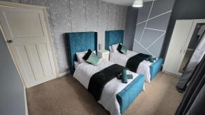Katil atau katil-katil dalam bilik di Your Home Away from Home in Birmingham