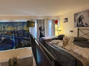 a bedroom with a bed and a painting on the wall at Exclusive Loft degli Artisti in Florence