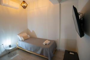 A bed or beds in a room at Ierapetra flats
