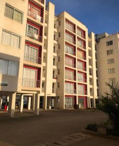 a large apartment building with a lot of windows at Sunstone Studio- Ngong Rd Near Junction Mall in Nairobi