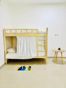 Postel nebo postele na pokoji v ubytování Sukoon Hostel