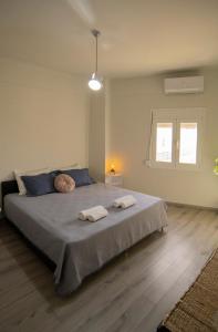 Posteľ alebo postele v izbe v ubytovaní Ierapetra flats 2