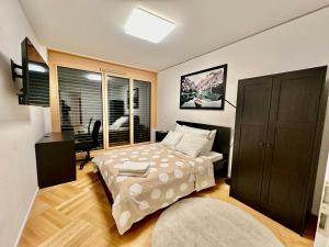Postel nebo postele na pokoji v ubytování Cosy apartment in Lausanne