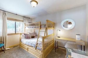 a bedroom with a bunk bed and a desk with a mirror at The Hideaway in Meadow Lake Park +21 photos