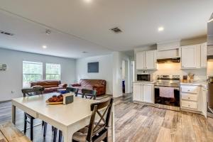 a kitchen and living room with a table and chairs at Bovees Riverhouse Dunnellon Family Getaway! in Dunnellon