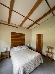 Ένα ή περισσότερα κρεβάτια σε δωμάτιο στο La Casa de Merling en Acopampa