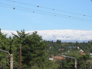 a view of snow covered mountains in the distance at Habitación doble en Casa Alpina in Villa General Belgrano