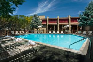 a large swimming pool in front of a hotel at Maverick Hotel and Casino by Red Lion Hotels in Elko