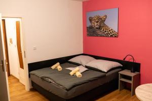 a room with a bed with two teddy bears on it at RheinmeetsMosel Rheinufer Deutsches Eck in Koblenz