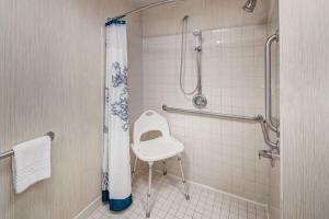 a bathroom with a shower with a toilet and a sink at Residence Inn Kansas City Country Club Plaza in Kansas City