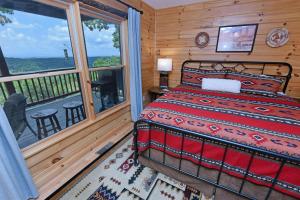 a bedroom with a bed and a balcony at Viva LaVista in Morganton