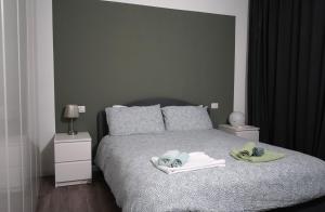 A bed or beds in a room at Navigli-Darsena In the Heart of the City