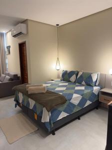 Ένα ή περισσότερα κρεβάτια σε δωμάτιο στο Flat em Alter do Chão