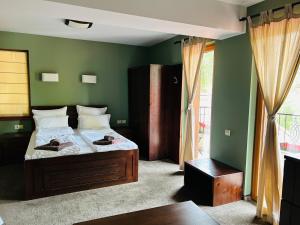 A bed or beds in a room at Villa Ema