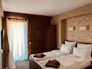 A bed or beds in a room at Villa Ema