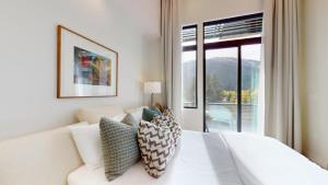 Ένα ή περισσότερα κρεβάτια σε δωμάτιο στο The Residences at One Twenty Unit 302