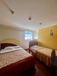 Postel nebo postele na pokoji v ubytování Hostal Wassiki